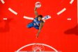 New York Knicks rookie guard Nate Robinson attempts a dunk during the 2006 NBA All-Star Slam Dunk contest, which he won.